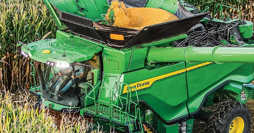 John Deere Combine in corn field daytime